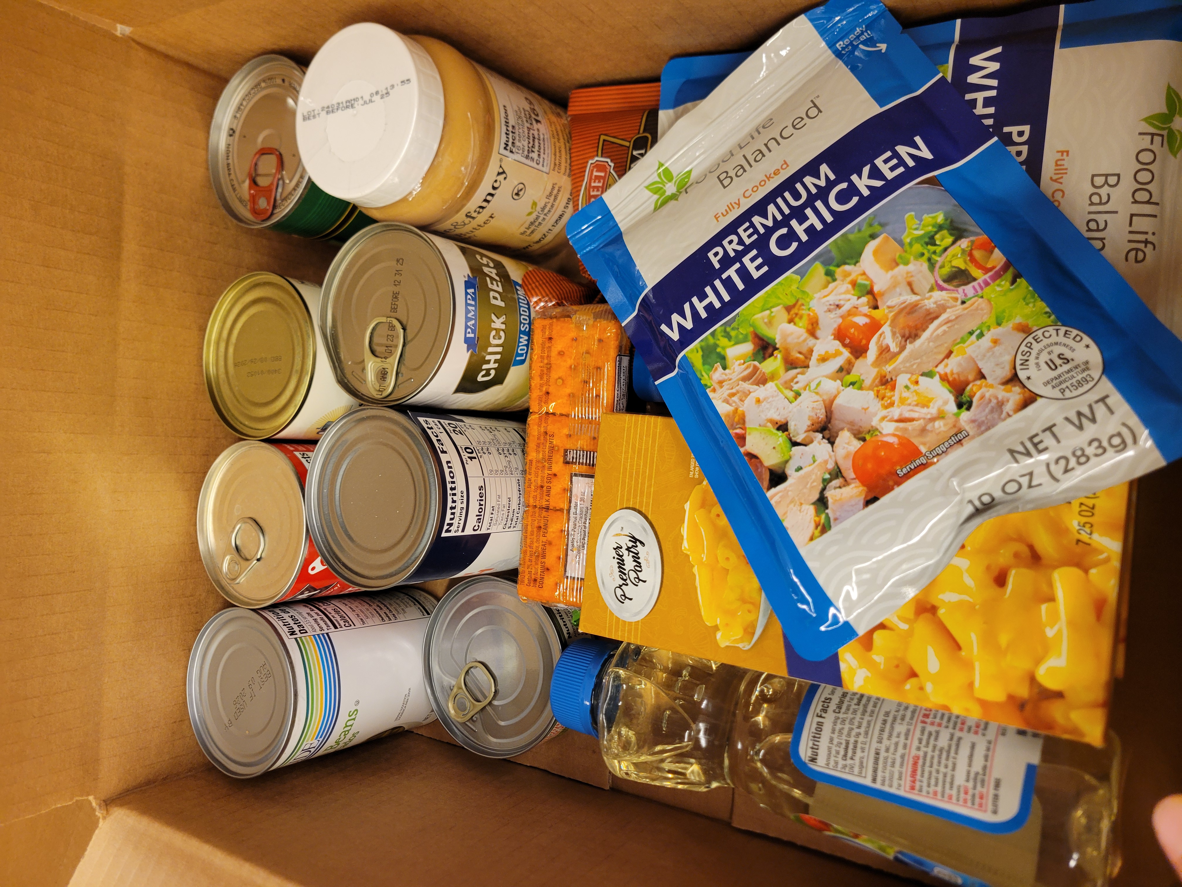 Cardboard box filled with dry goods.